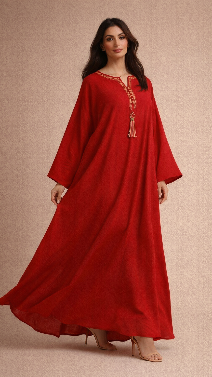 Woman wearing a red dress with long sleeves on a beige background